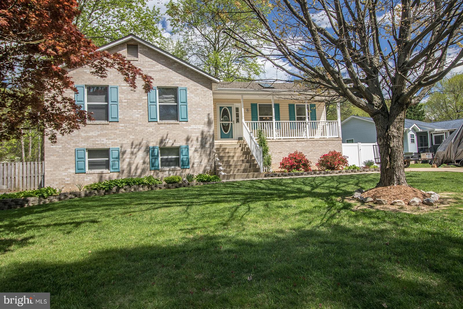 11620 Big Sandy Run Road Lusby, MD 20657 - Photo 59 of 64 a front view of house with yard and green space