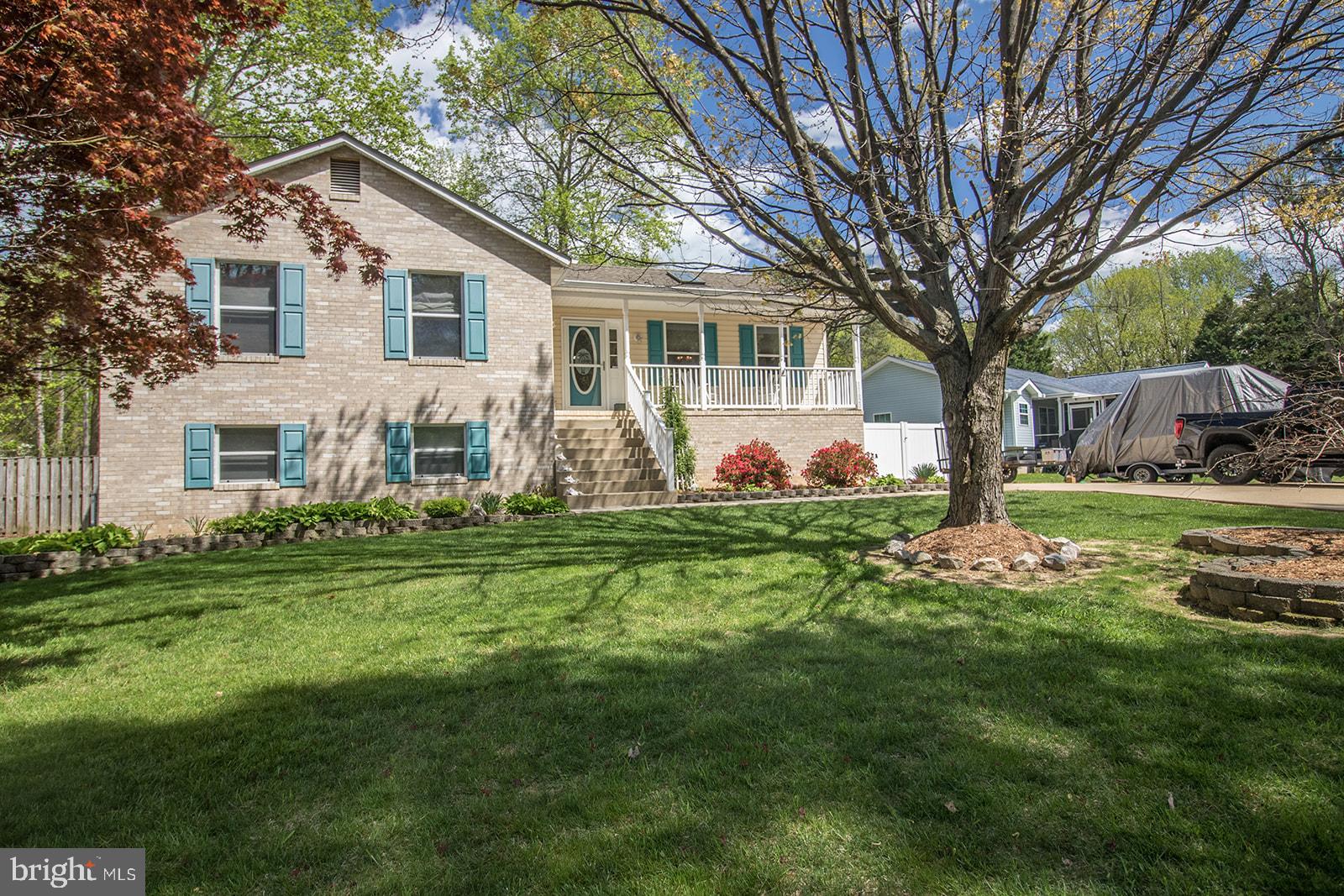 11620 Big Sandy Run Road Lusby, MD 20657 - Photo 60 of 64 a front view of a house with garden