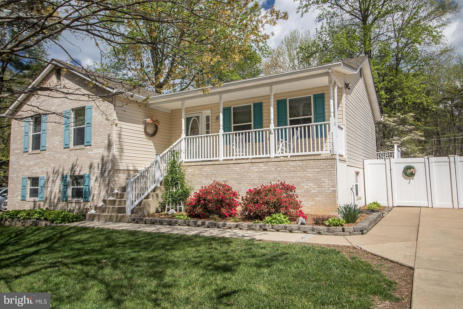 11620 Big Sandy Run Road Lusby, MD 20657 - Photo 61 of 64 front view of a house with a yard