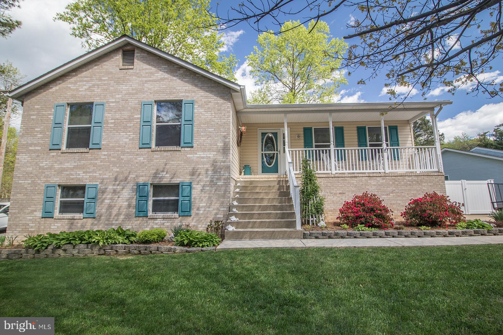 11620 Big Sandy Run Road Lusby, MD 20657 - Photo 63 of 64 a front view of house with yard and green space