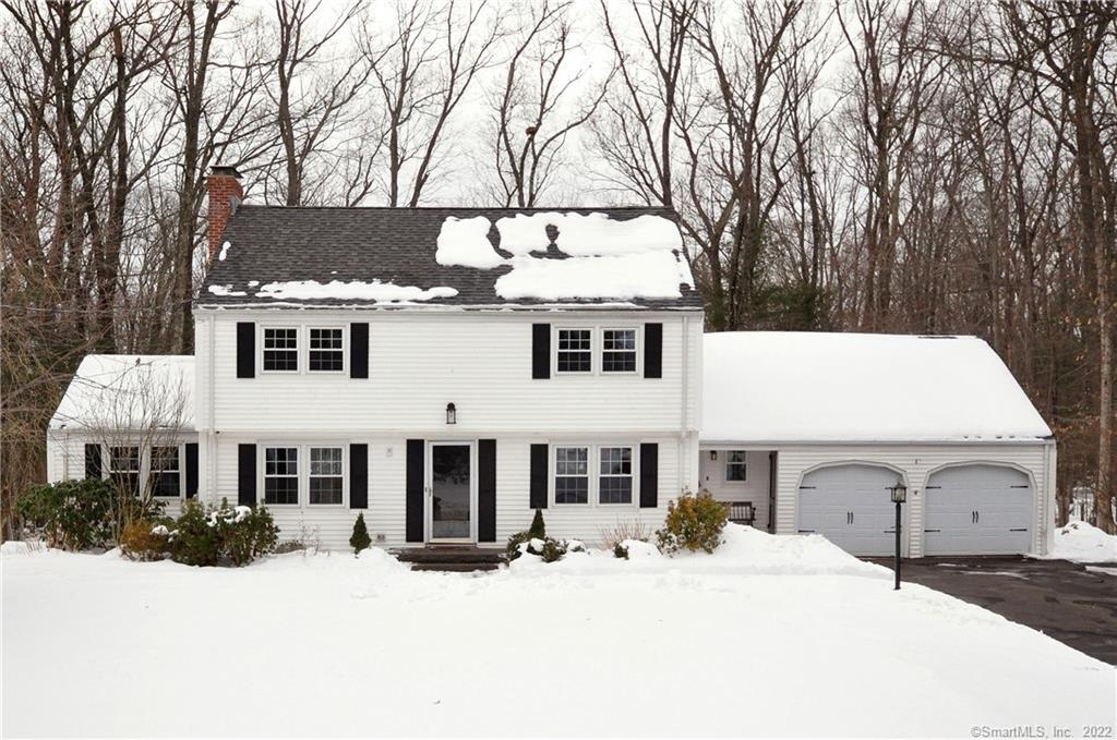 13 Sunset Hill Road Simsbury, CT 06070 - Photo 1 of 1 a front view of a house with a yard covered in snow