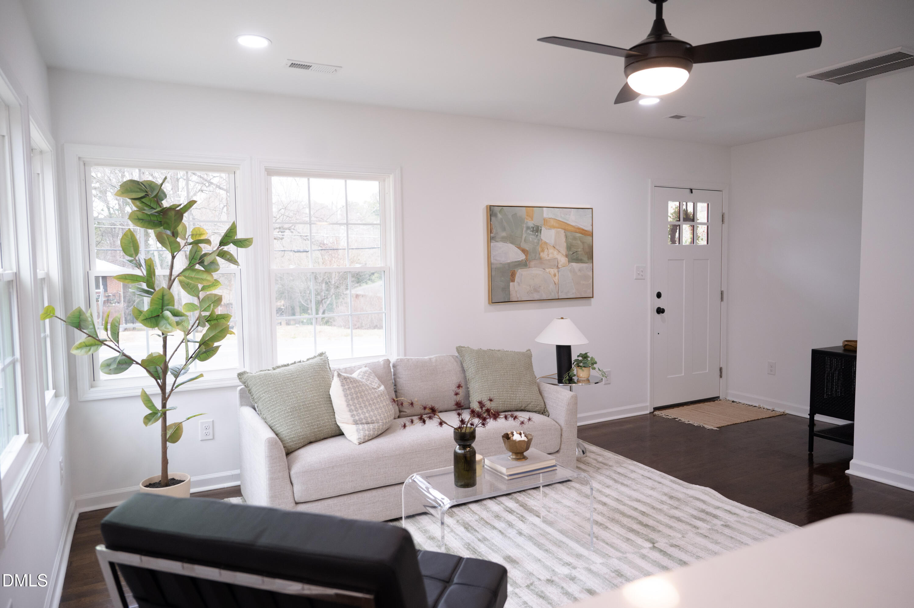 809 Leon Street Durham, NC 27704 - Photo 6 of 30 a living room with furniture and a flat screen tv