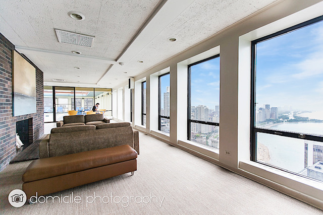 260 East Chestnut Street, Unit 3201 Chicago, IL 60611 - Photo 13 of 15 a living room with furniture and a large window