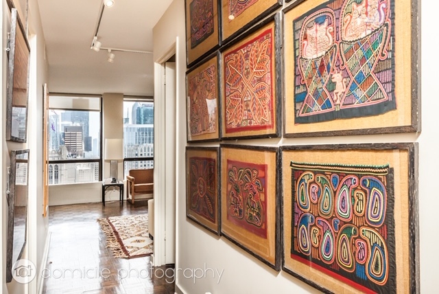260 East Chestnut Street, Unit 3201 Chicago, IL 60611 - Photo 6 of 15 a view of a hallway with wooden floor and furniture