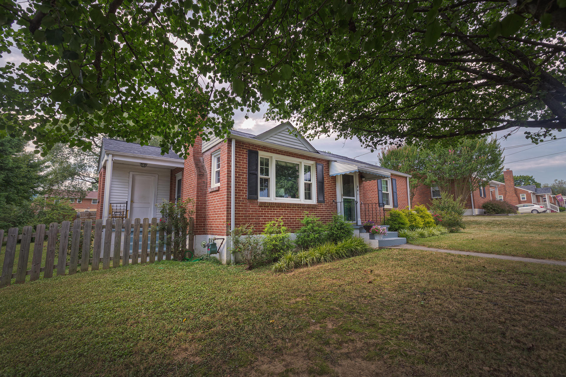 a front view of a house with garden