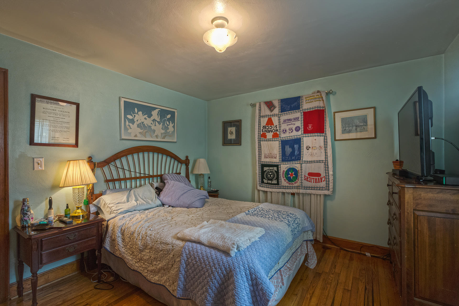241 Knoll Road Roanoke, VA 24019 - Photo 12 of 18 a bedroom with a bed and a flat tv screen on dresser