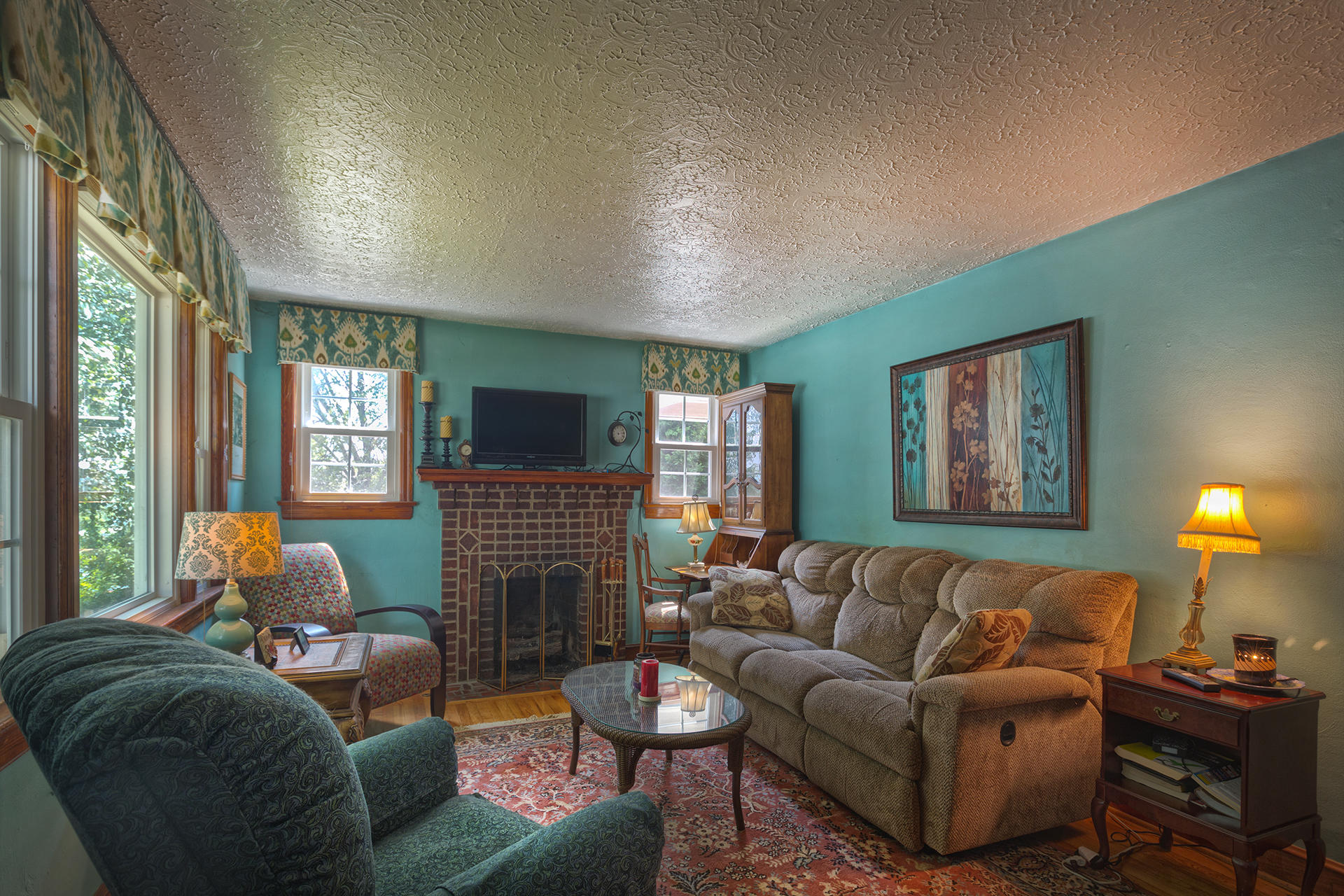 241 Knoll Road Roanoke, VA 24019 - Photo 4 of 18 a living room with furniture a fireplace and a flat screen tv