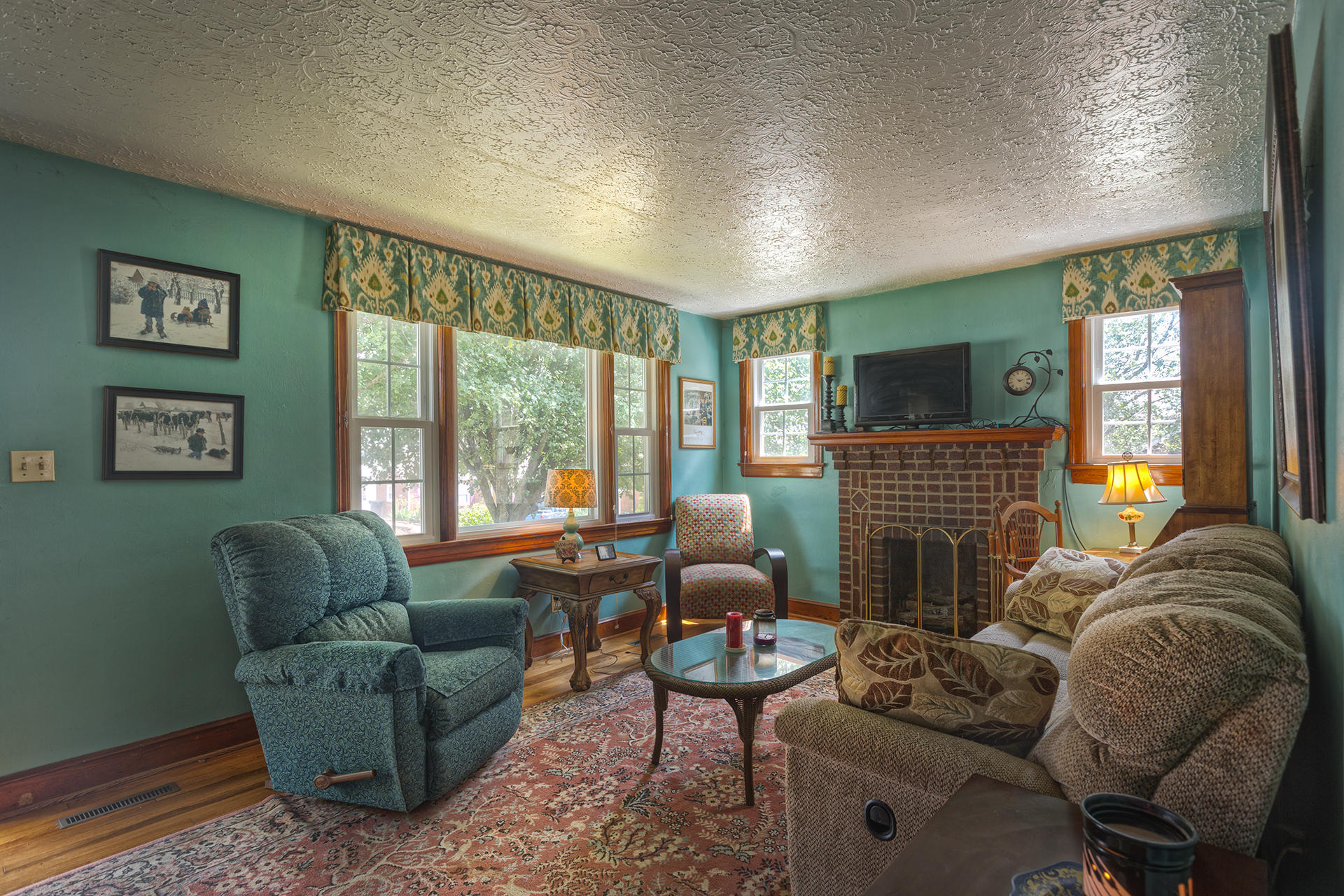 241 Knoll Road Roanoke, VA 24019 - Photo 5 of 18 a living room with furniture a large window and a fireplace