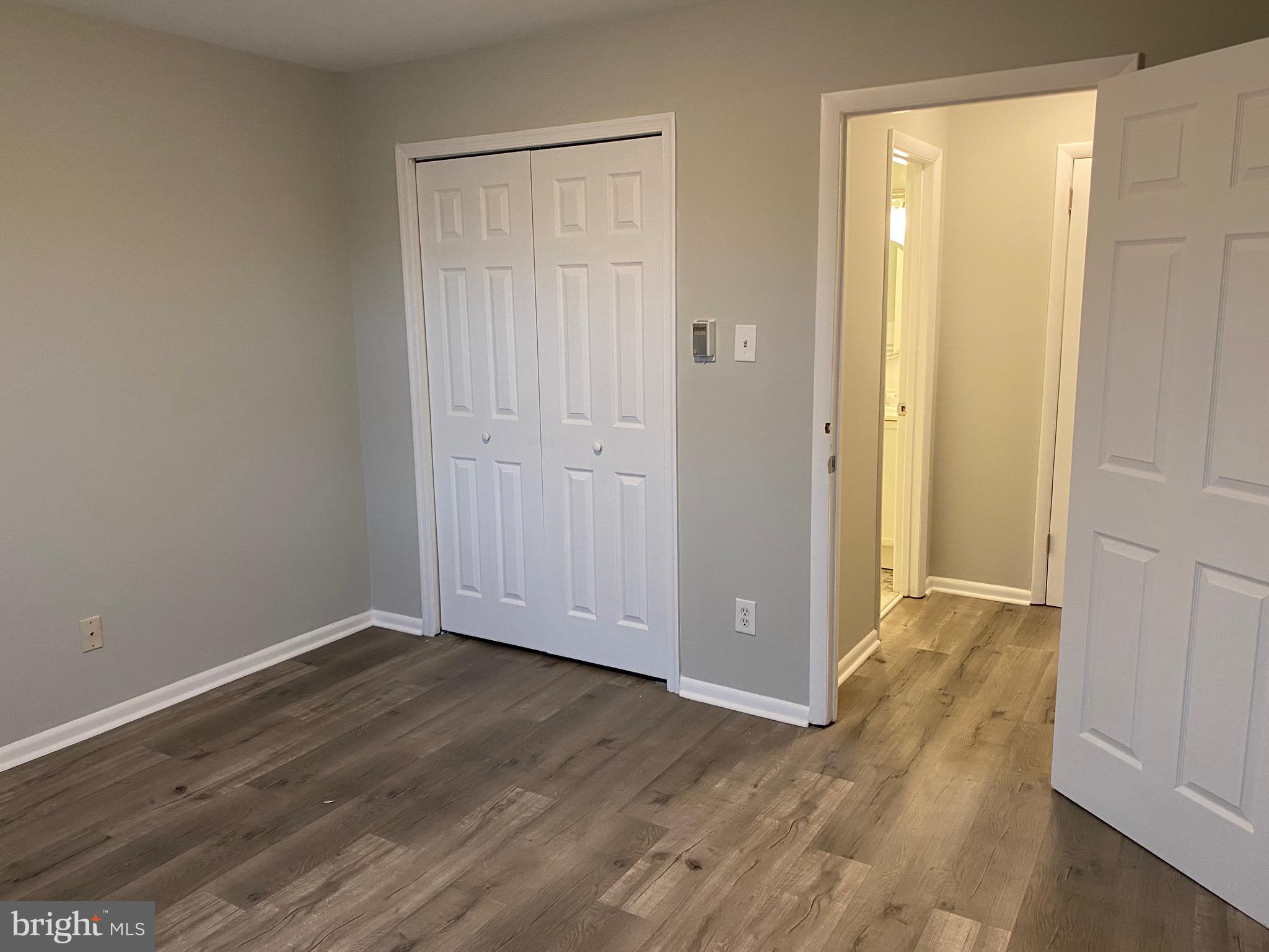 4256 Buckman Road, Unit 27 Alexandria, VA 22309 - Photo 13 of 30 a view of an empty room with wooden floor and closet