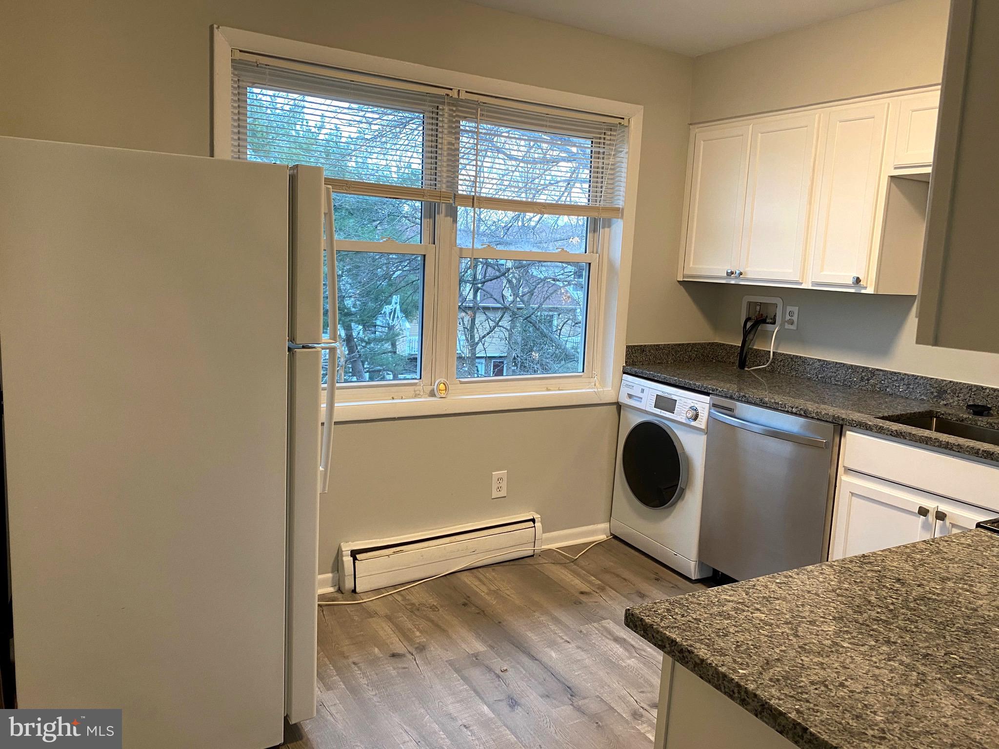 4256 Buckman Road, Unit 27 Alexandria, VA 22309 - Photo 2 of 30 a kitchen with a stove a sink and a window