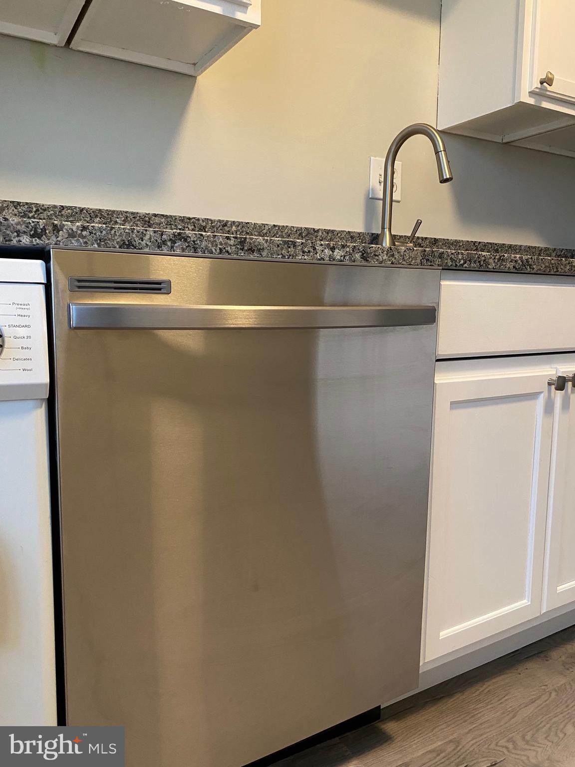 4256 Buckman Road, Unit 27 Alexandria, VA 22309 - Photo 5 of 30 a close view of a sink and a cabinet in the kitchen