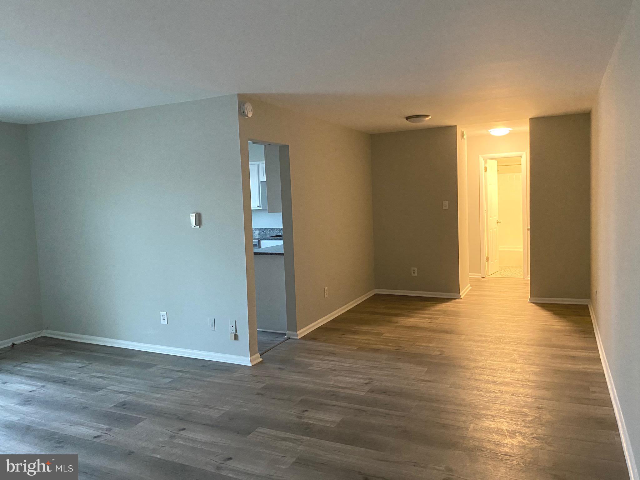 4256 Buckman Road, Unit 27 Alexandria, VA 22309 - Photo 7 of 30 a view of an empty room with wooden floor