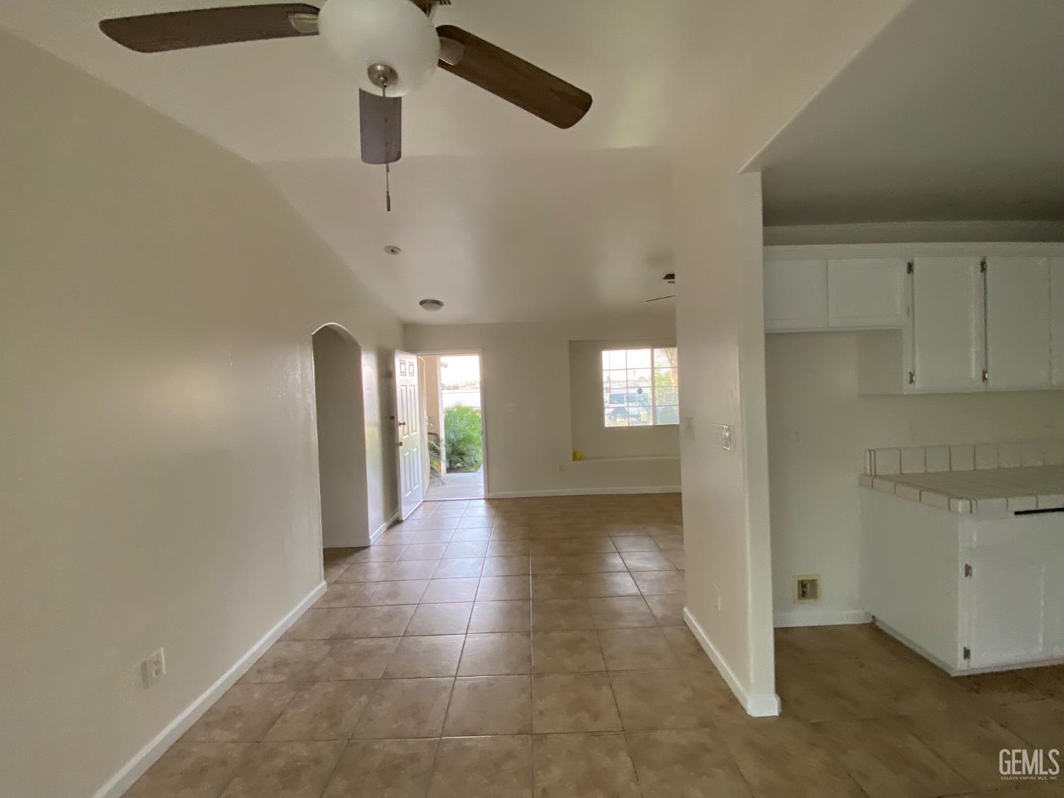 Undisclosed Address Bakersfield, CA 93307 - Photo 11 of 34 a view of a hallway with chandelier