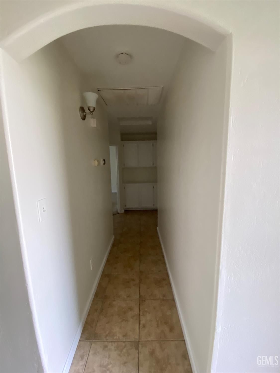 Undisclosed Address Bakersfield, CA 93307 - Photo 16 of 34 a view of a hallway