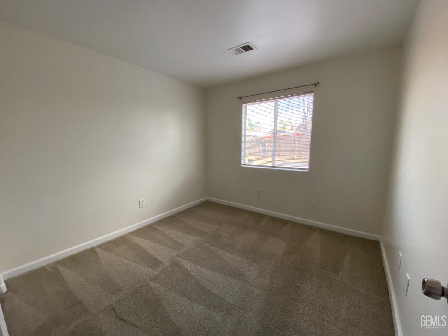 Undisclosed Address Bakersfield, CA 93307 - Photo 17 of 34 an empty room with a window