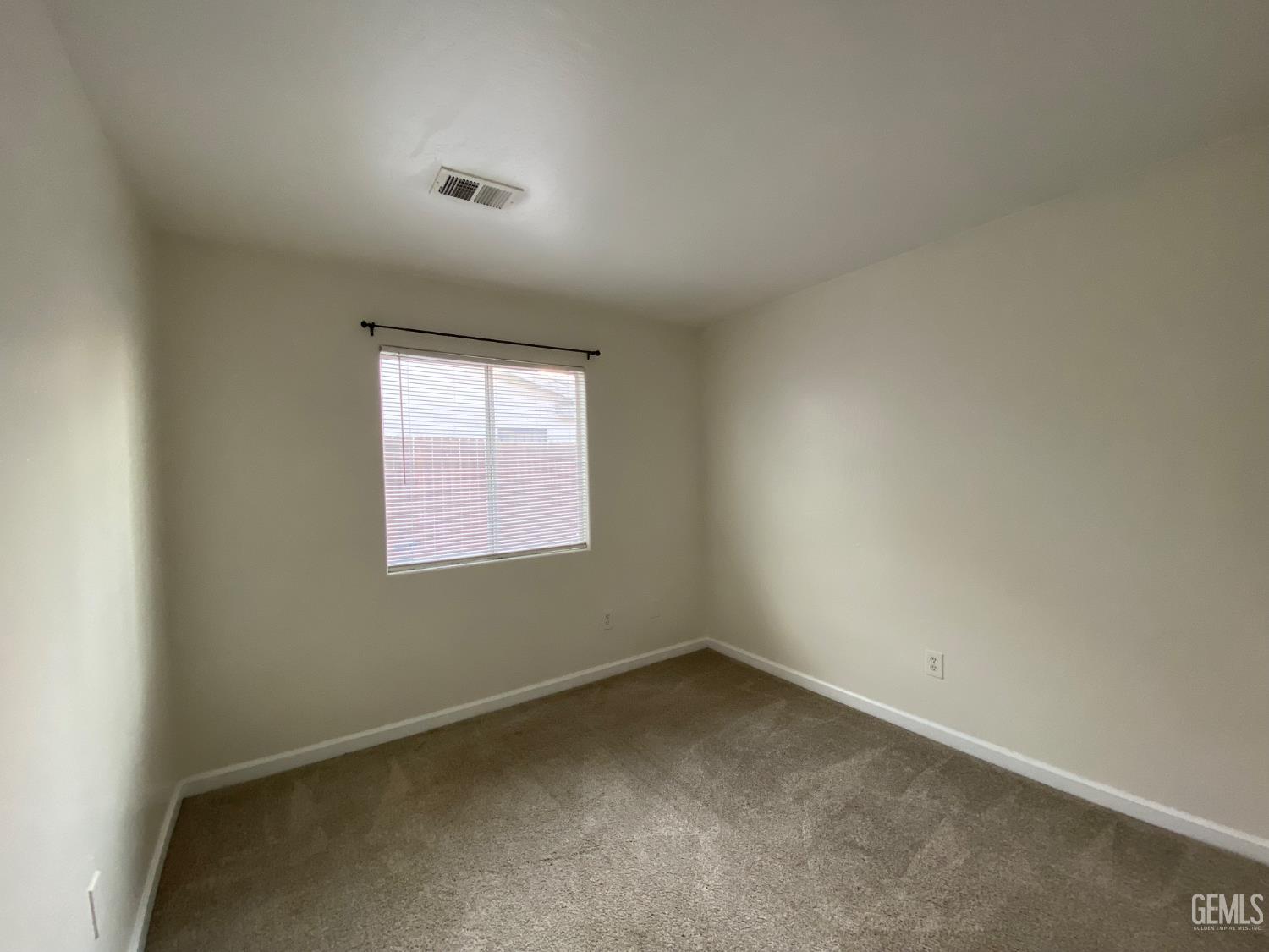 Undisclosed Address Bakersfield, CA 93307 - Photo 26 of 34 an empty room with a window