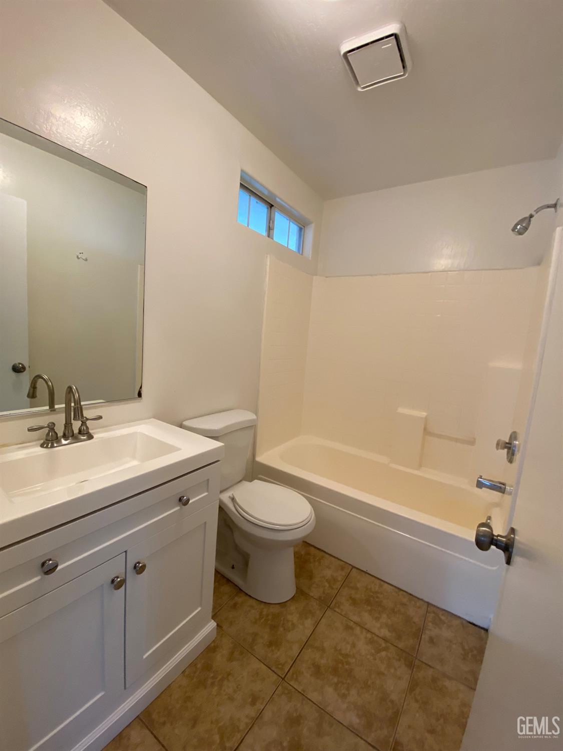 Undisclosed Address Bakersfield, CA 93307 - Photo 28 of 34 a bathroom with a sink a toilet and shower
