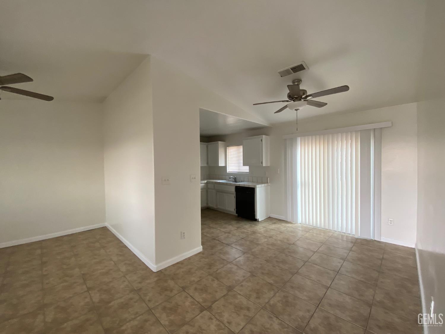Undisclosed Address Bakersfield, CA 93307 - Photo 7 of 34 a view of an empty room with a window