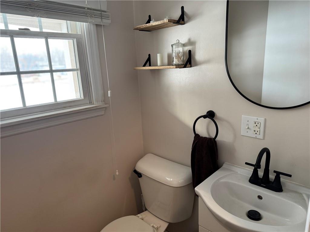2072 Boyd School Road Wampum, PA 16157 - Photo 11 of 45 a bathroom with a toilet sink and mirror