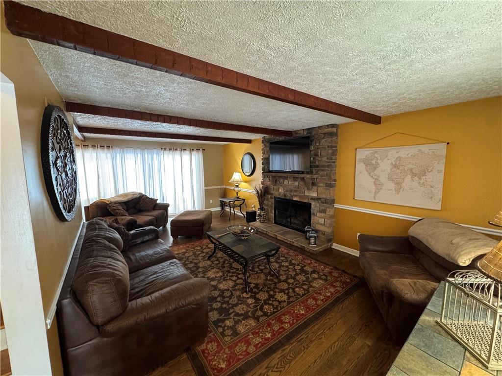 2072 Boyd School Road Wampum, PA 16157 - Photo 14 of 45 a living room with furniture or couch and a fireplace