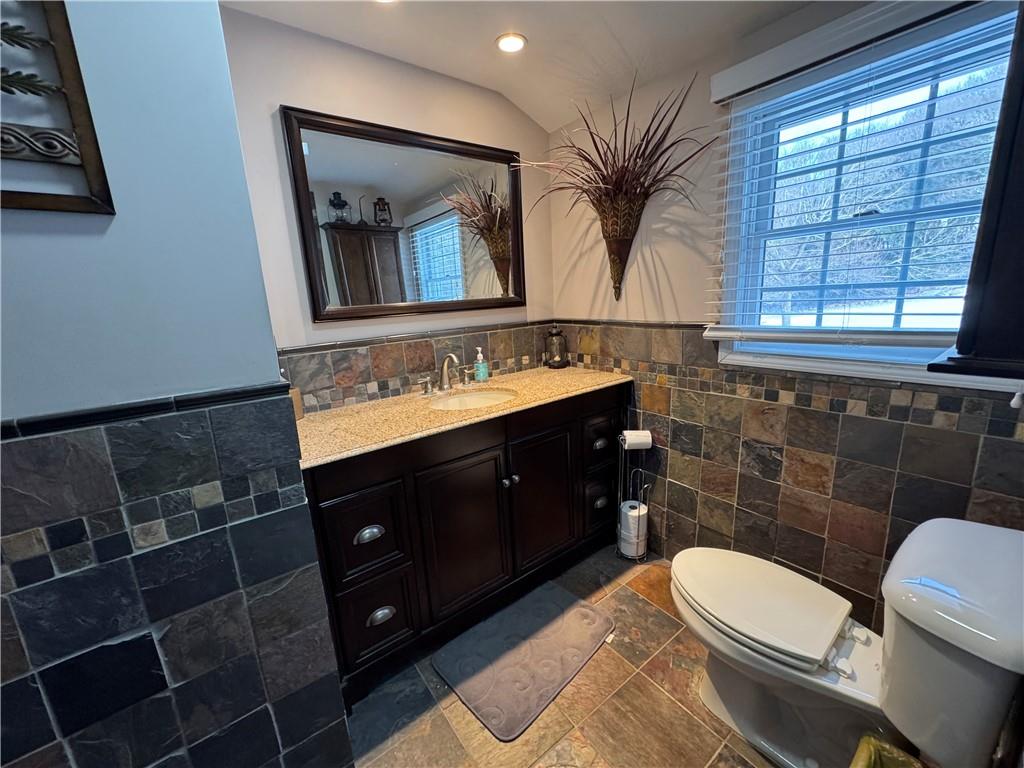 2072 Boyd School Road Wampum, PA 16157 - Photo 17 of 45 a bathroom with a toilet sink and mirror