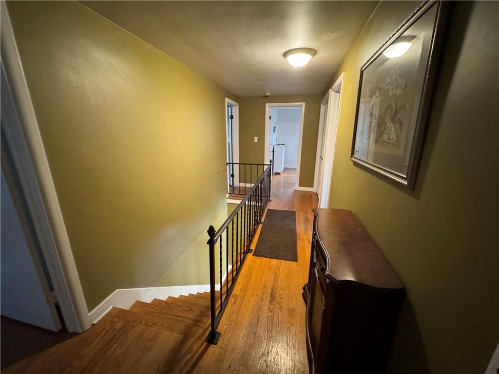 2072 Boyd School Road Wampum, PA 16157 - Photo 23 of 45 a view of a hallway with wooden floor and staircase