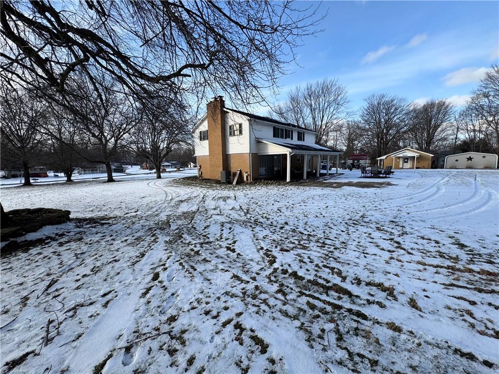 2072 Boyd School Road Wampum, PA 16157 - Photo 35 of 45 a backyard of a house with large trees
