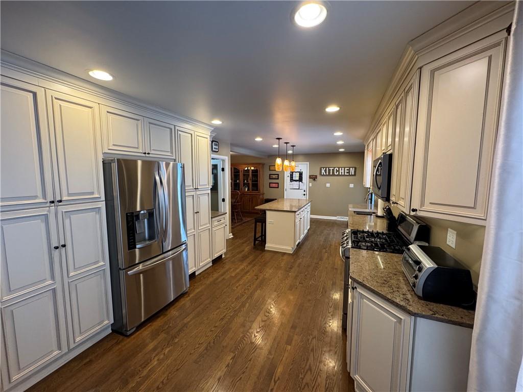 2072 Boyd School Road Wampum, PA 16157 - Photo 5 of 45 a kitchen with a refrigerator a sink and cabinets