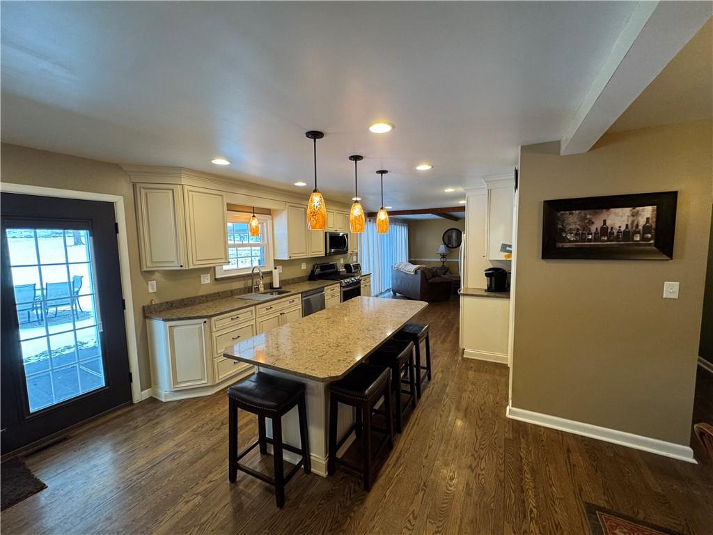 2072 Boyd School Road Wampum, PA 16157 - Photo 6 of 45 a kitchen with a table chairs refrigerator and microwave