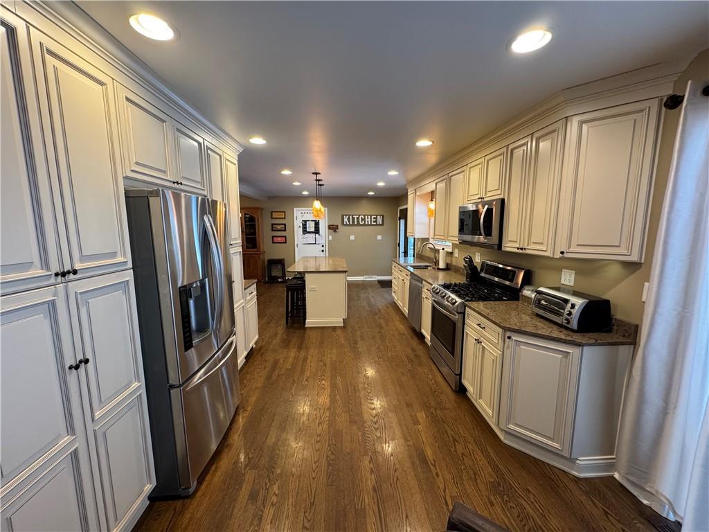 2072 Boyd School Road Wampum, PA 16157 - Photo 7 of 45 a kitchen with stainless steel appliances a refrigerator a stove a sink and a refrigerator