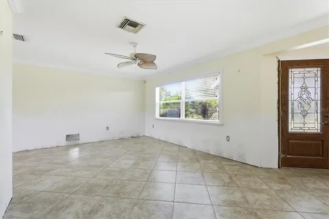 a view of an empty room with a window