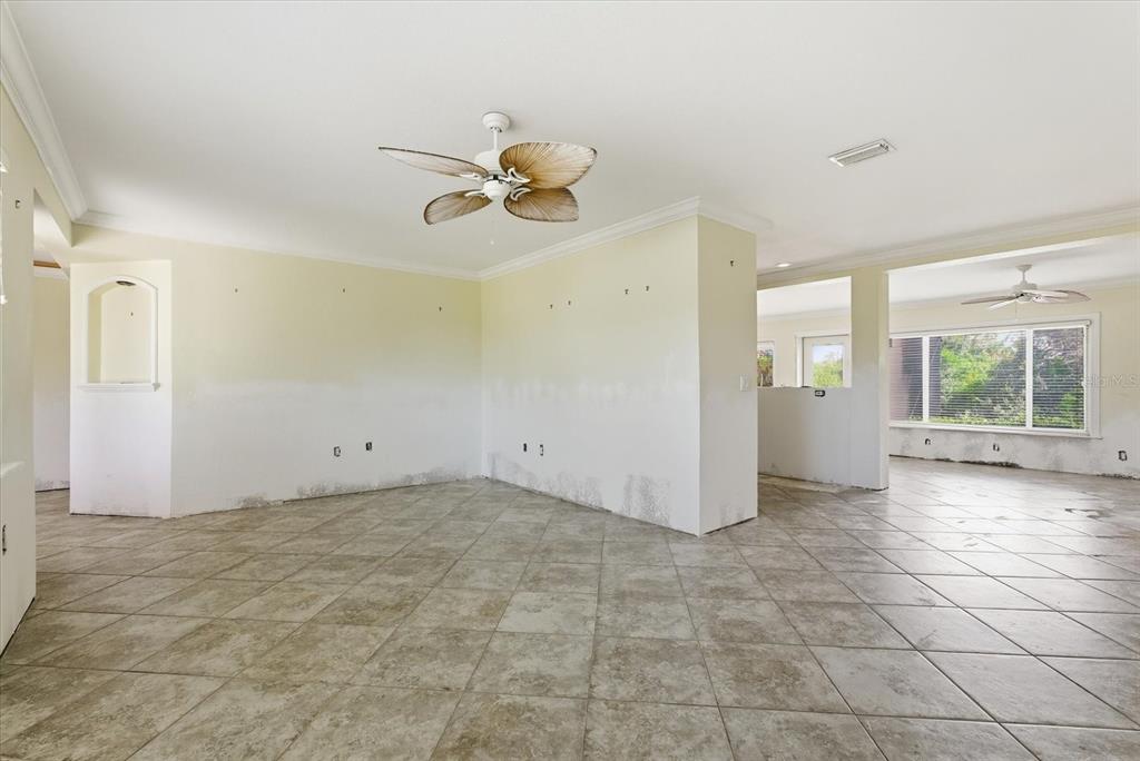 229 Stratford Road Englewood, FL 34223 - Photo 14 of 49 a view of an empty room with a window