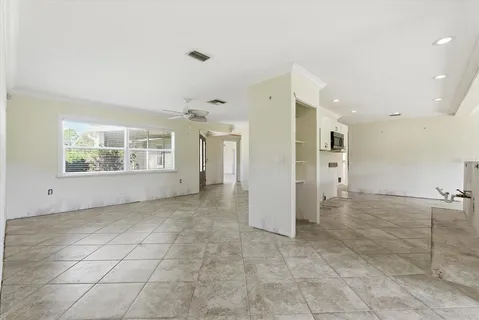a view of a kitchen with a refrigerator and a sink