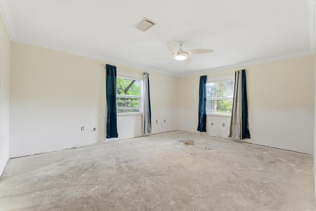 229 Stratford Road Englewood, FL 34223 - Photo 25 of 49 an empty room with windows and closet