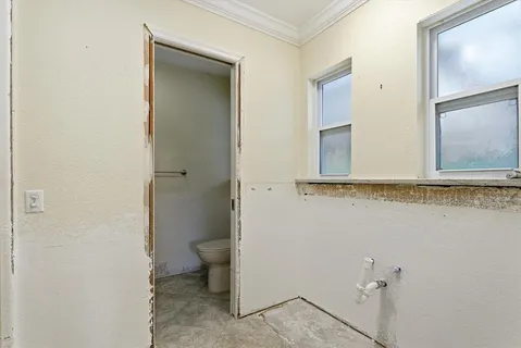 a bathroom with a shower and a sink