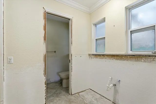 a bathroom with a shower and a sink