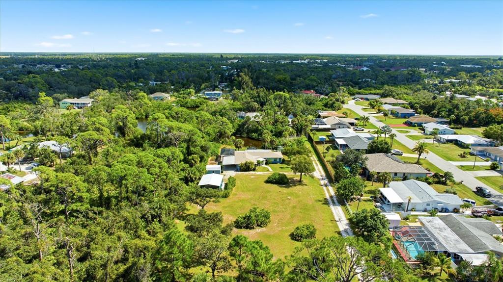 229 Stratford Road Englewood, FL 34223 - Photo 39 of 49 an aerial view of residential houses with outdoor space and trees