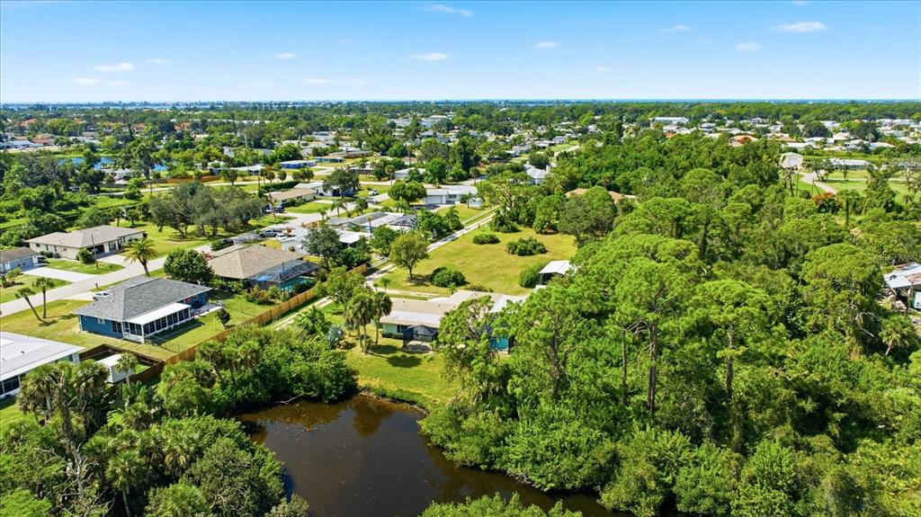 229 Stratford Road Englewood, FL 34223 - Photo 42 of 49 an aerial view of residential houses with outdoor space and trees