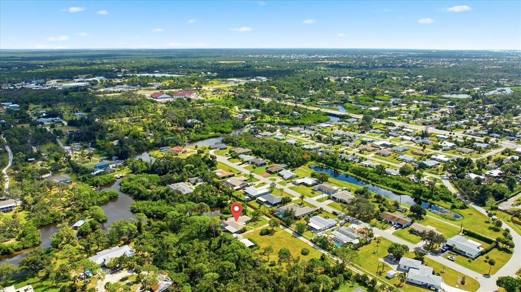 229 Stratford Road Englewood, FL 34223 - Photo 47 of 49 an aerial view of residential houses with outdoor space and trees
