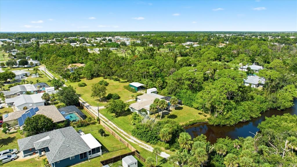 229 Stratford Road Englewood, FL 34223 - Photo 5 of 49 an aerial view of residential houses with outdoor space and trees