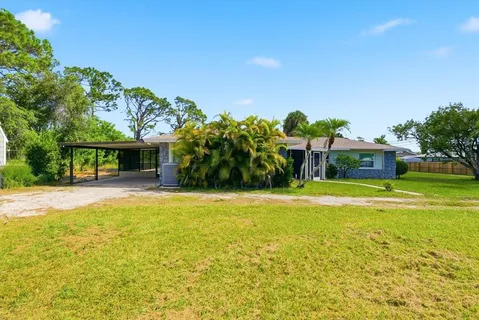 a front view of a house with swimming pool