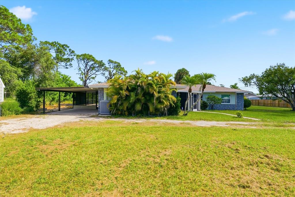 229 Stratford Road Englewood, FL 34223 - Photo 8 of 49 a front view of a house with swimming pool