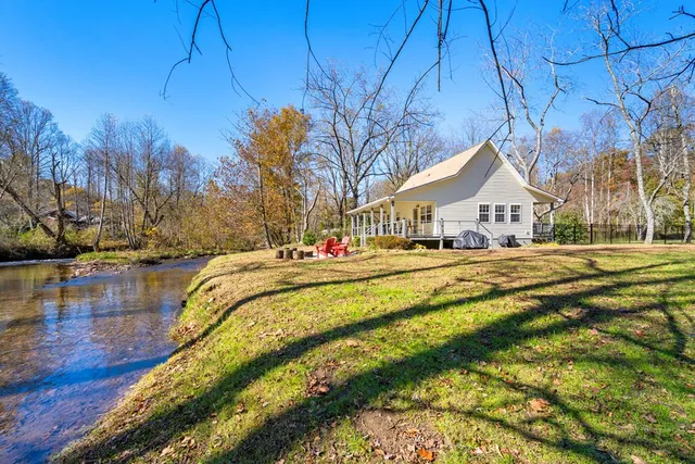 a view of swimming pool with seating area