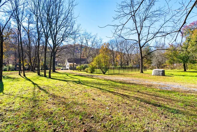a view of yard with swimming pool