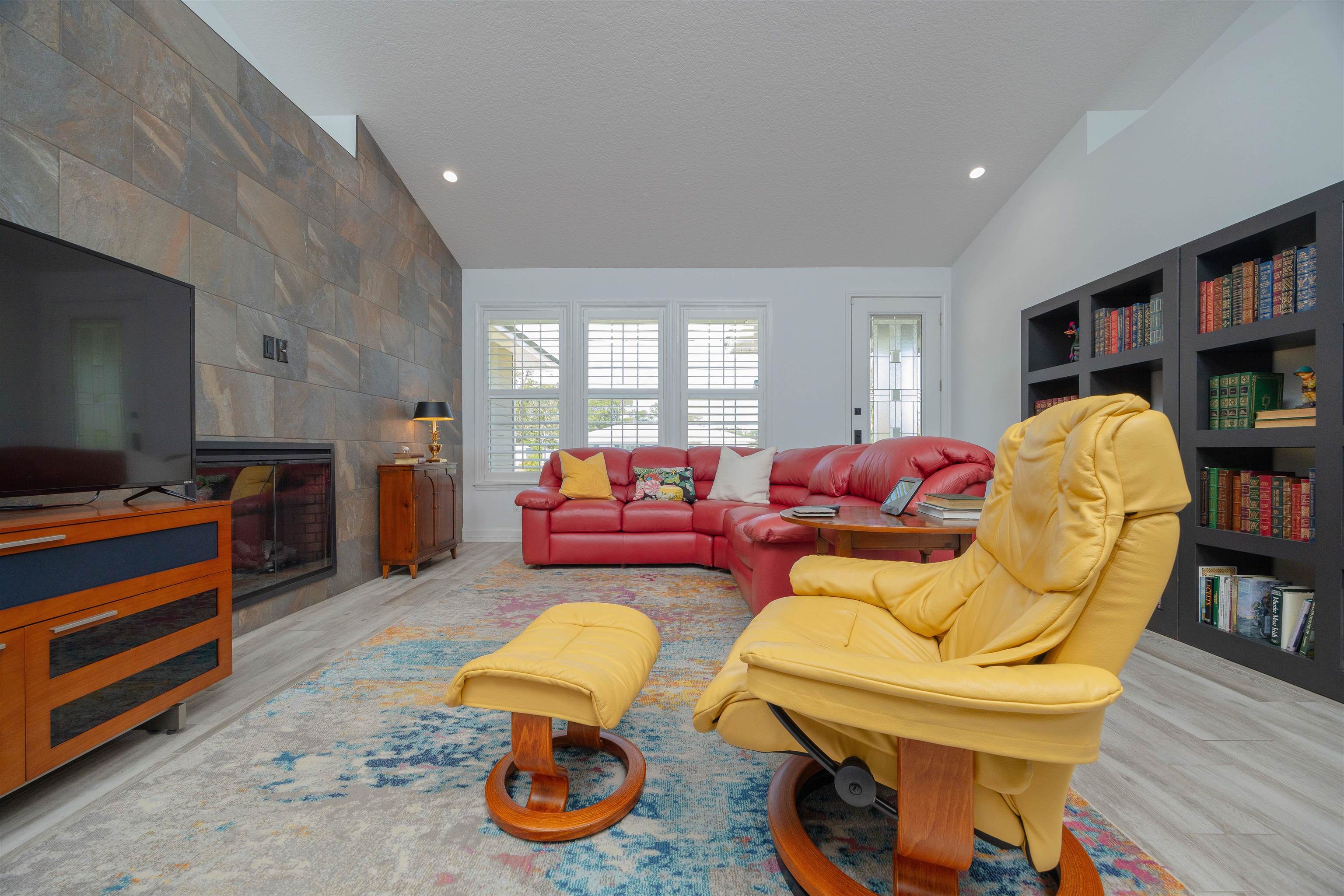 301 Graciela Circle St. Augustine, FL 32086 - Photo 12 of 84 a living room with furniture a flat screen tv and a window