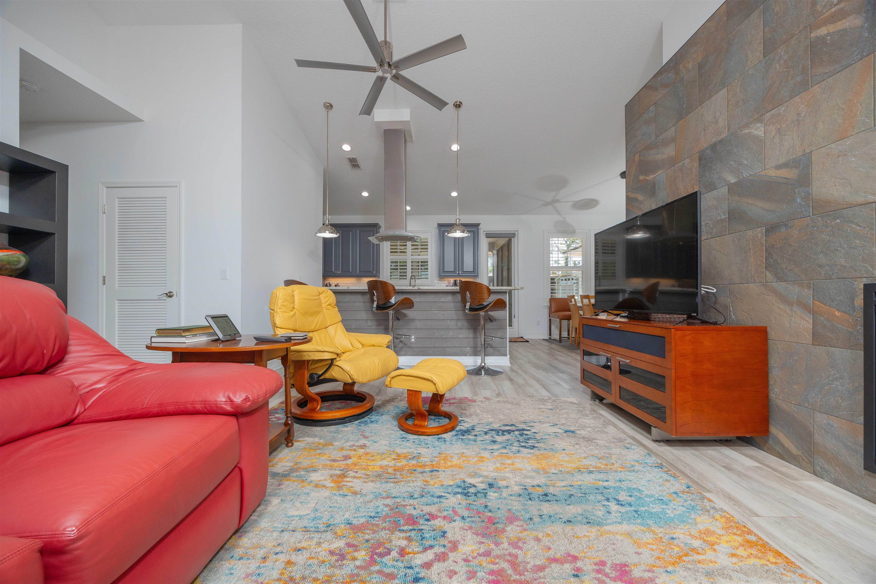 301 Graciela Circle St. Augustine, FL 32086 - Photo 15 of 84 a living room with furniture kitchen view and a flat screen tv