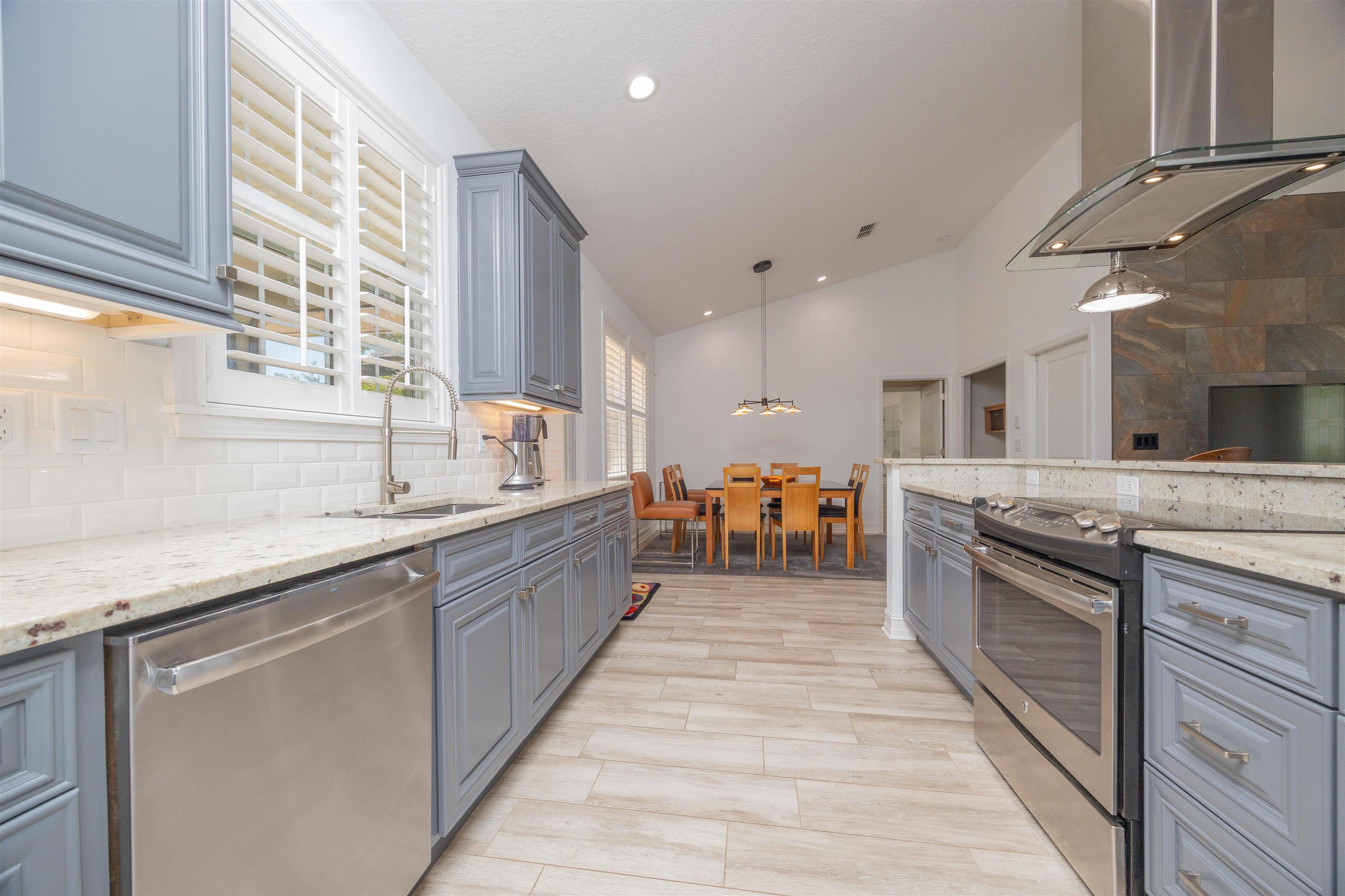 301 Graciela Circle St. Augustine, FL 32086 - Photo 26 of 84 a large kitchen with stainless steel appliances granite countertop a lot of counter space and a sink