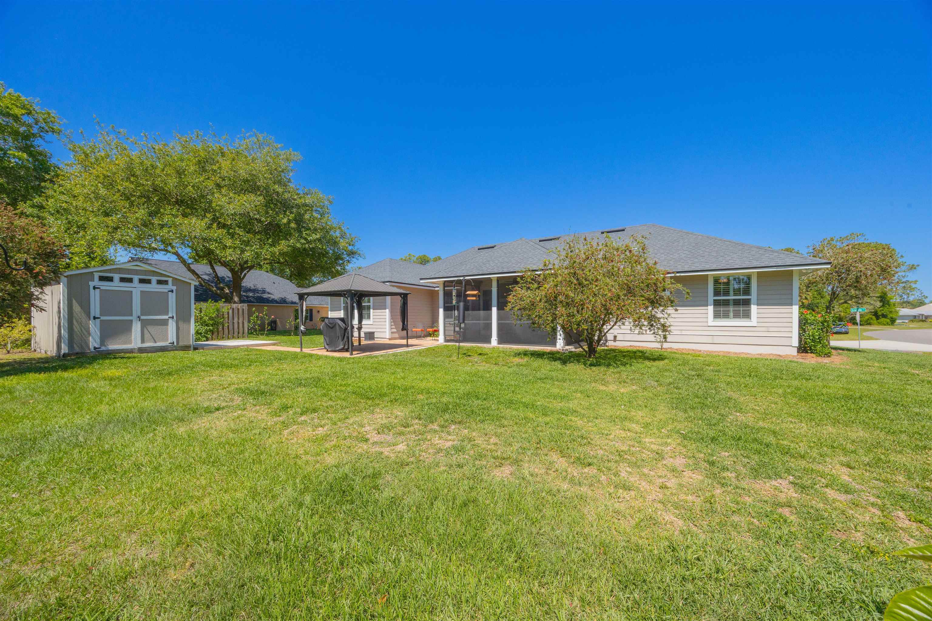 301 Graciela Circle St. Augustine, FL 32086 - Photo 33 of 84 a front view of a house with a garden