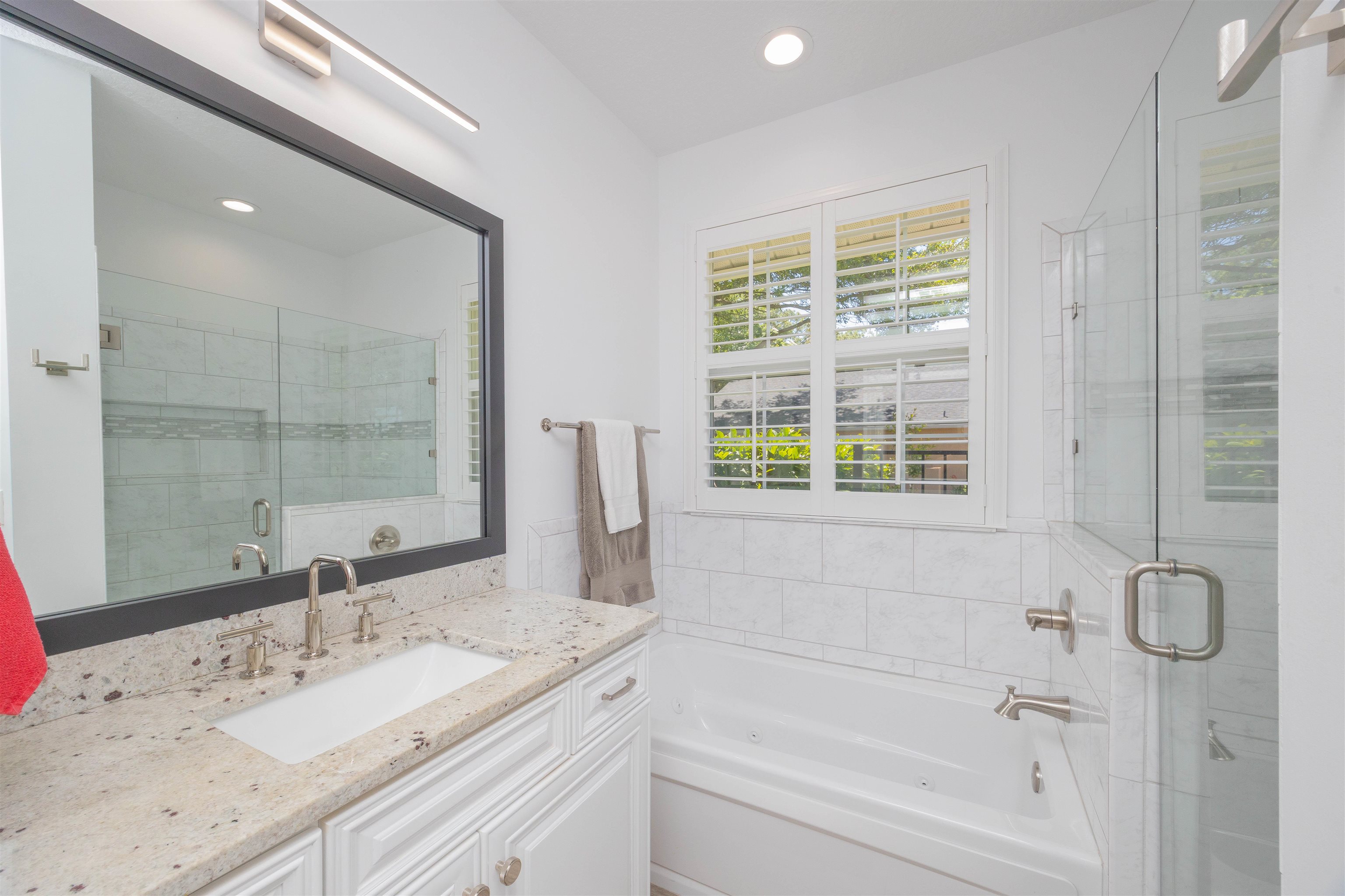 301 Graciela Circle St. Augustine, FL 32086 - Photo 47 of 84 a bathroom with a granite countertop sink and a bathtub