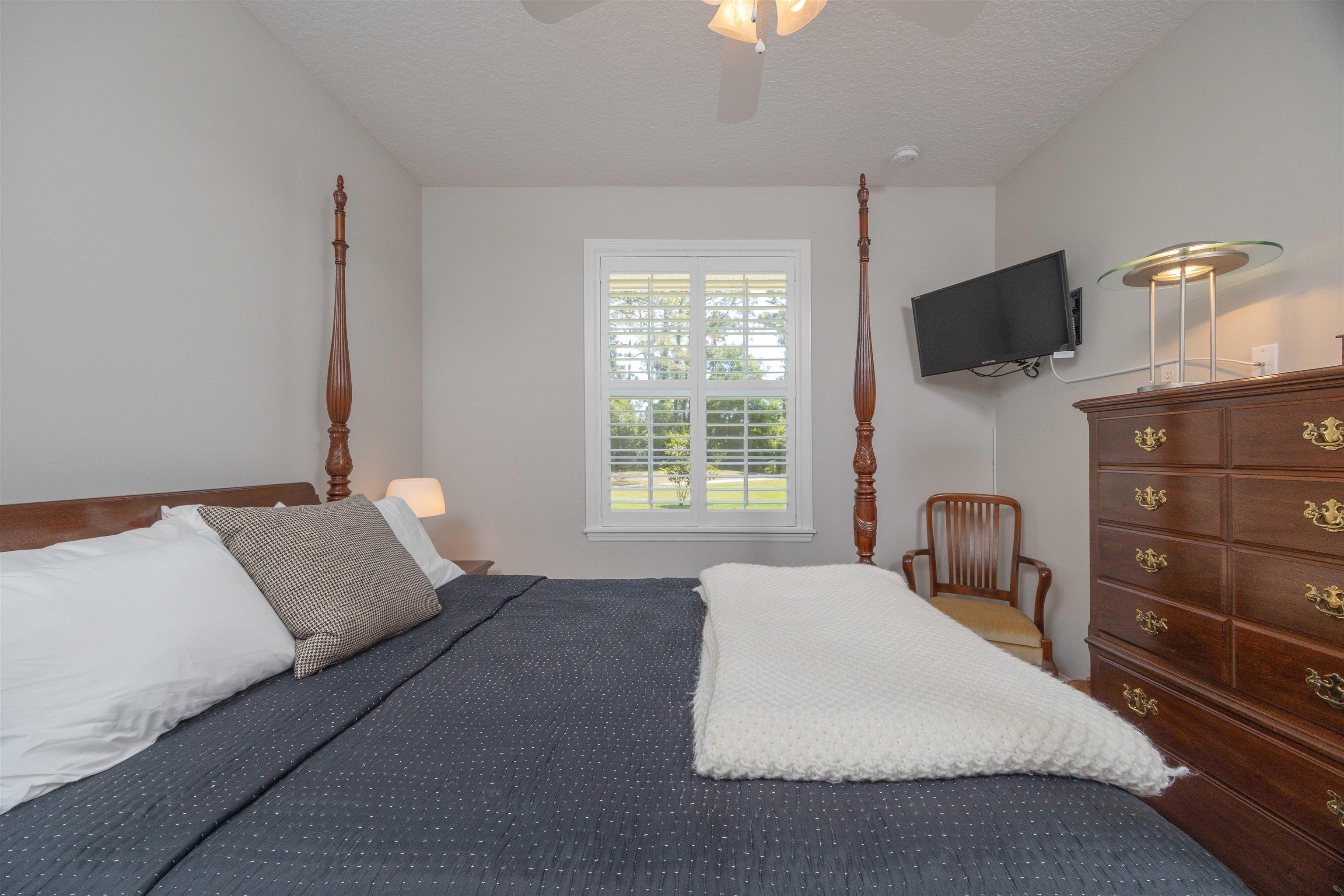 301 Graciela Circle St. Augustine, FL 32086 - Photo 51 of 84 a bedroom with a bed and a flat screen tv